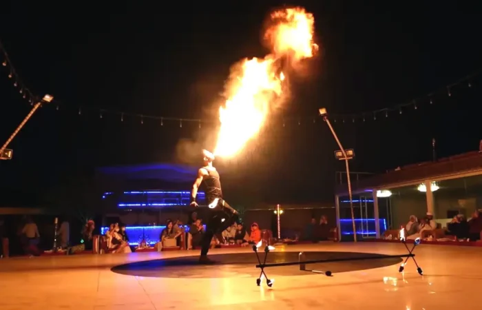 Man performing fire show at desert safari dubai camp