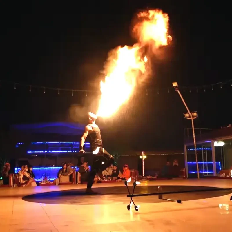 Man performing fire show at desert safari dubai camp
